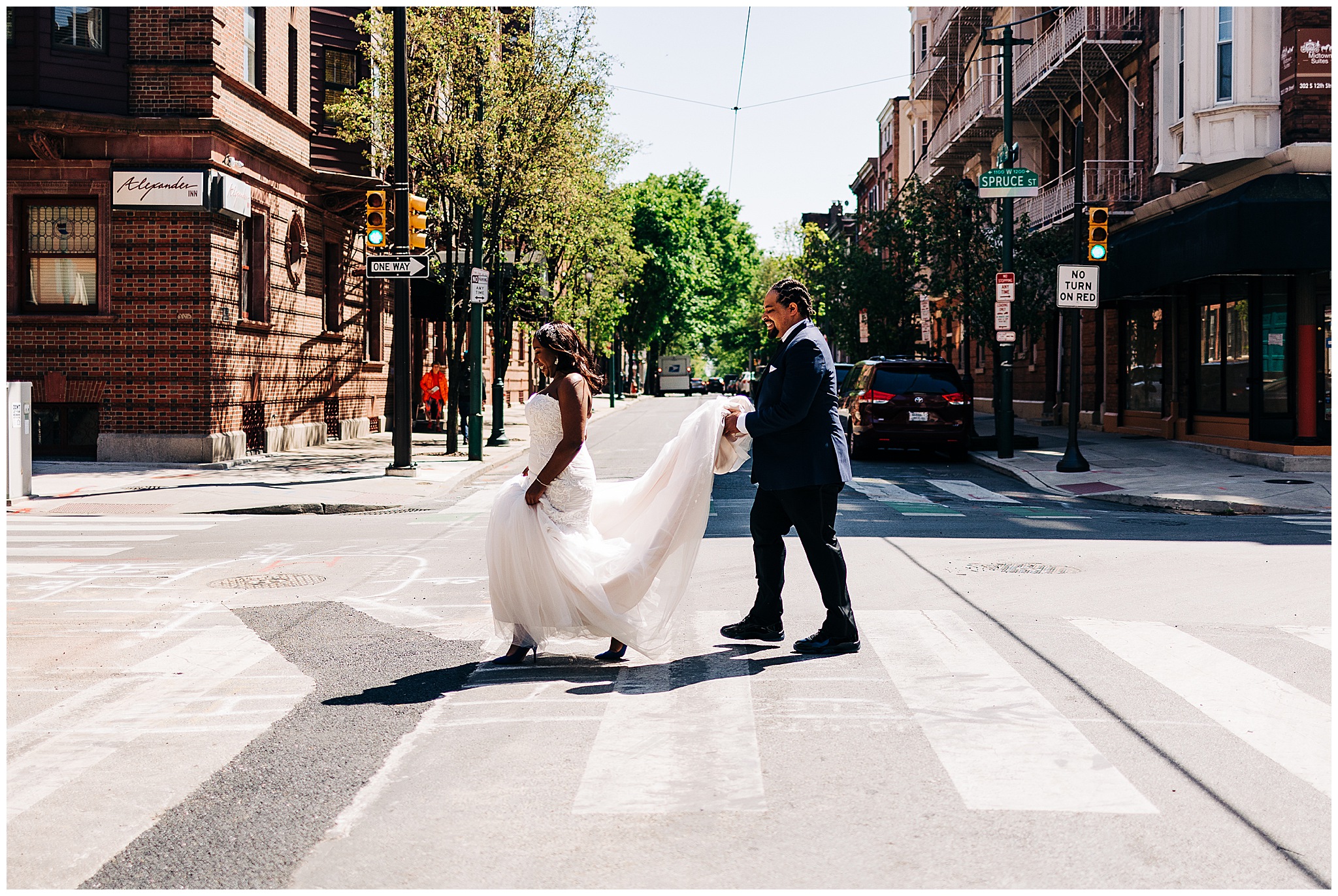 bride and groom walking throough the streets of philly on their wedding day